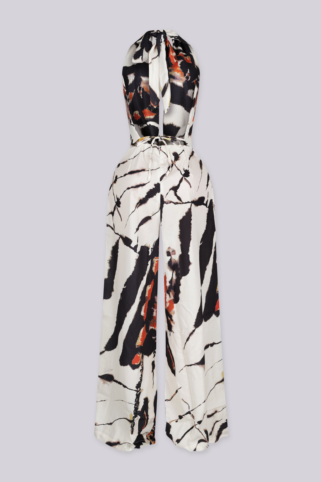 Marble printed halter neckline crop top with a deep V plunging cut to the waist
Adjustable tie back closure