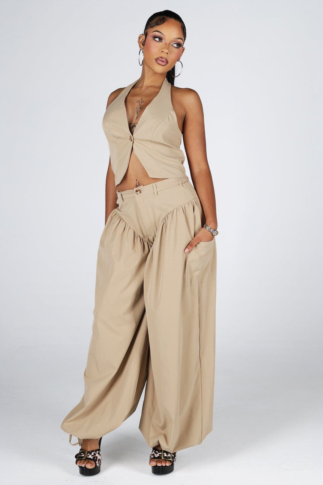 Halter crop top featuring a plunging neckline with&amp;nbsp;a peekaboo waist cutout