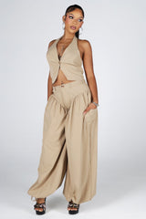 Halter crop top featuring a plunging neckline with&amp;nbsp;a peekaboo waist cutout