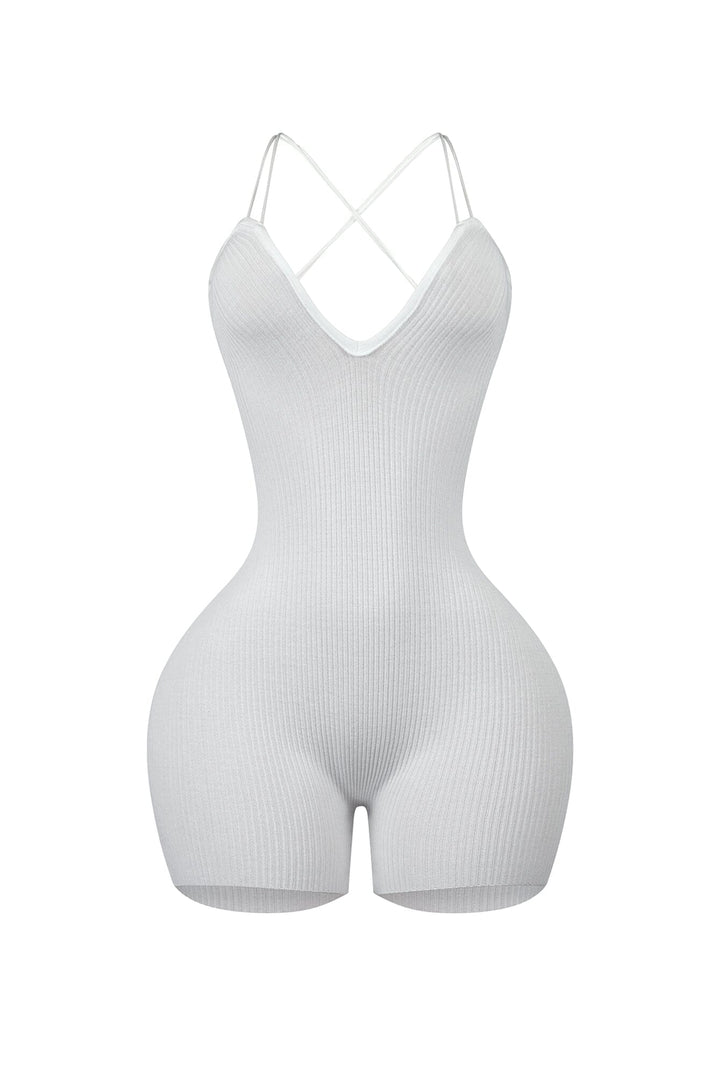 Ribbed knit sleeveless romper with deep V-neck featuring double straps and lace up back
Vertical center seam with ruched and cinches for contouring