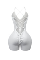 Ribbed knit sleeveless romper with deep V-neck featuring double straps and lace up back
Vertical center seam with ruched and cinches for contouring