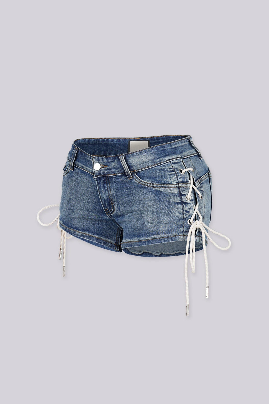 Low rise denim shorts with crisscross rope lacing through metal eyelets detailing