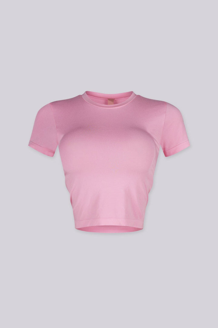 EDGEBYKS - Crew neckline seamless short sleeve crop top t shirt with ribbed hem and cuffs, pink front view