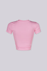 EDGEBYKS - Crew neckline seamless short sleeve crop top t shirt with ribbed hem and cuffs, pink back view