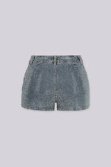 High rise denim shorts covered edge to edge in sparkling rhinestone studs, back view