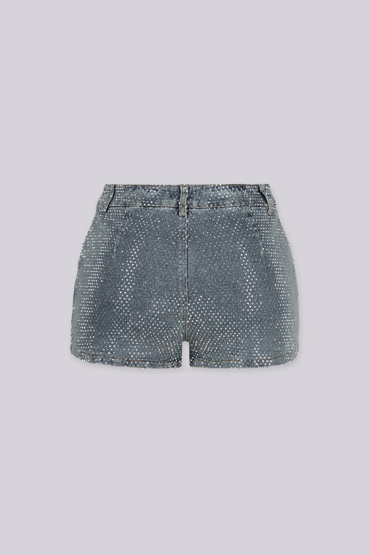 High rise denim shorts covered edge to edge in sparkling rhinestone studs, back view