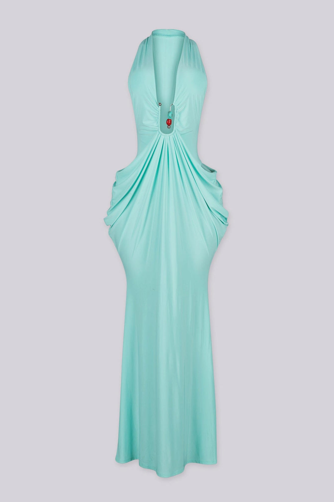 Deep plunging V front halter neck dress featuring bold side cut out at the midriff with U ring hardware detail at center front, Fitted through the hip with draped ruching that pools into the skirt
