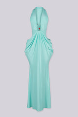 Deep plunging V front halter neck dress featuring bold side cut out at the midriff with U ring hardware detail at center front, Fitted through the hip with draped ruching that pools into the skirt