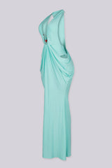Deep plunging V front halter neck dress featuring bold side cut out at the midriff with U ring hardware detail at center front, Fitted through the hip with draped ruching that pools into the skirt