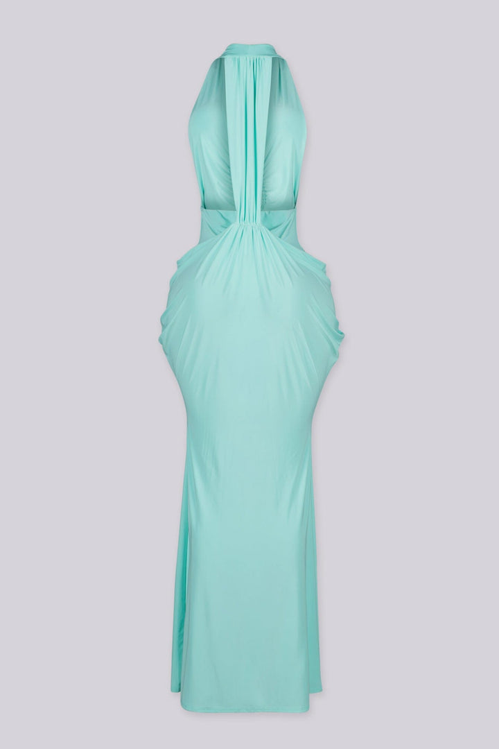 Deep plunging V front halter neck dress featuring bold side cut out at the midriff with U ring hardware detail at center front, Fitted through the hip with draped ruching that pools into the skirt