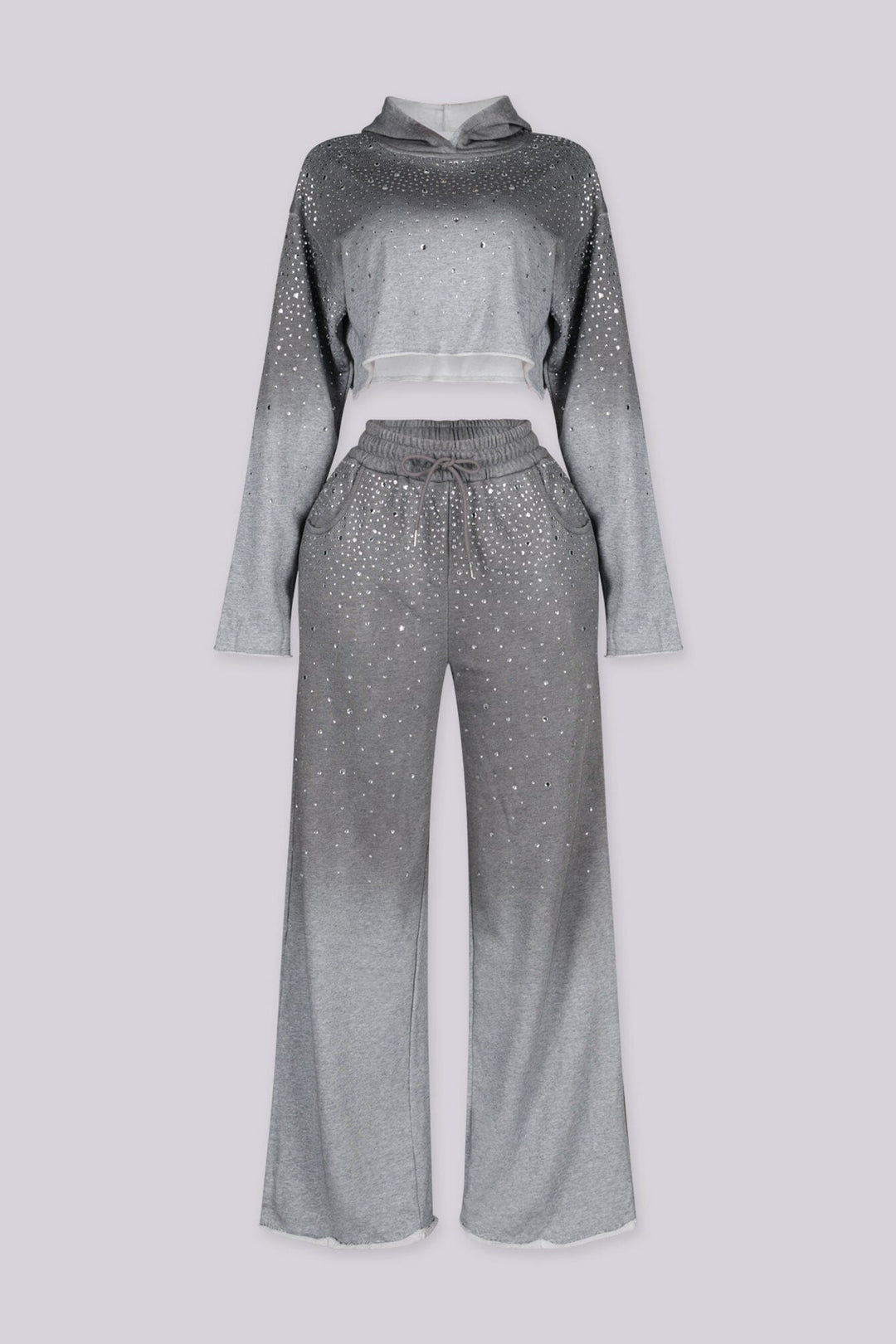 Cropped long sleeves hoodie with raw edge hem
Matching wide leg pants with elastic drawstring waistband, side pockets and raw edge hem