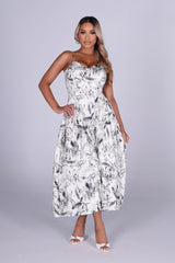 Floral print midi dress with plunging V neckline and thin straps featuring smocked back for stretch fit