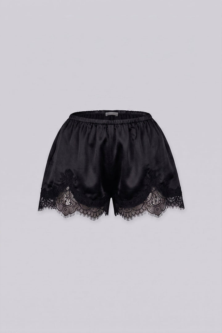 Silky elastic-waist shorts with a soft draped finish
Delicate lace trim hem adds a subtle feminine edge