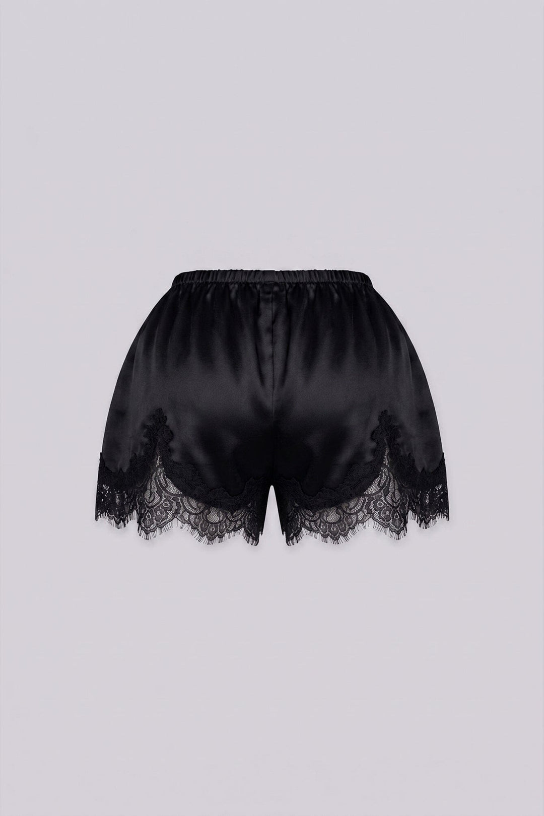 Silky elastic-waist shorts with a soft draped finish
Delicate lace trim hem adds a subtle feminine edge