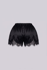 Silky elastic-waist shorts with a soft draped finish
Delicate lace trim hem adds a subtle feminine edge