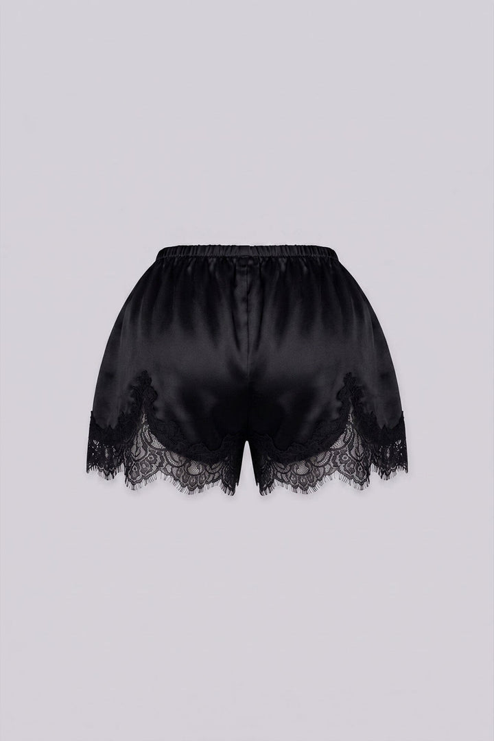 Silky elastic-waist shorts with a soft draped finish
Delicate lace trim hem adds a subtle feminine edge