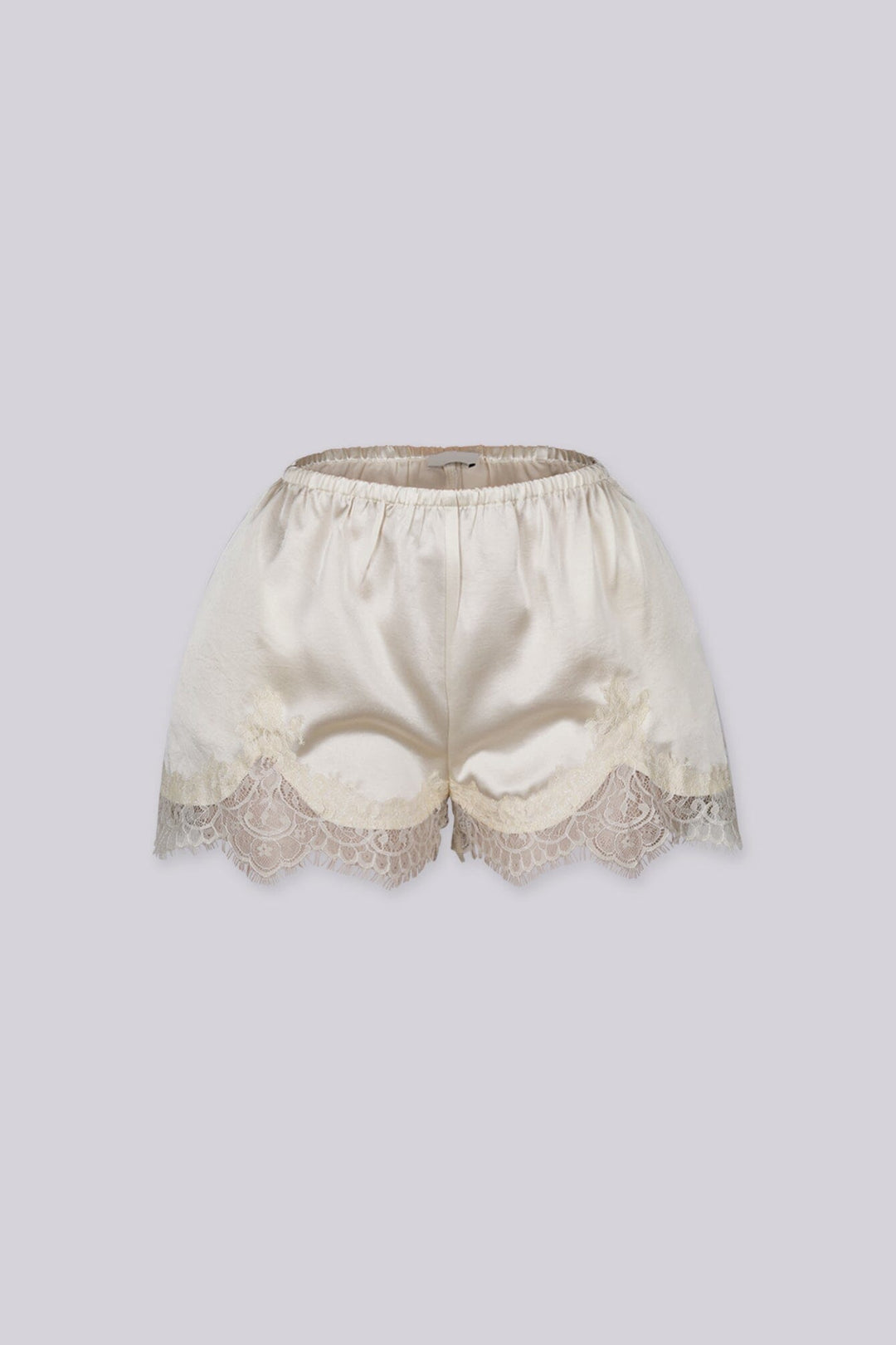 Silky elastic-waist shorts with a soft draped finish
Delicate lace trim hem adds a subtle feminine edge