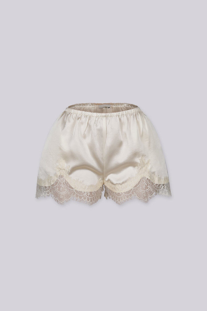 Silky elastic-waist shorts with a soft draped finish
Delicate lace trim hem adds a subtle feminine edge