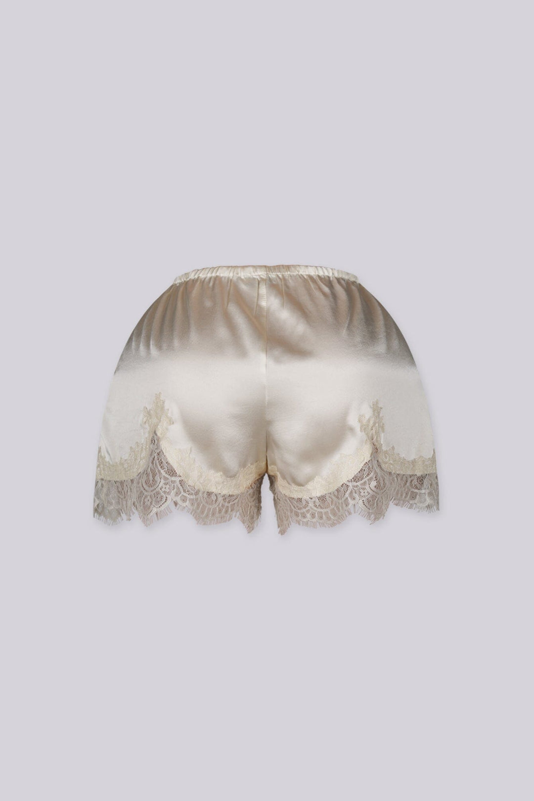 Silky elastic-waist shorts with a soft draped finish
Delicate lace trim hem adds a subtle feminine edge