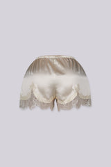 Silky elastic-waist shorts with a soft draped finish
Delicate lace trim hem adds a subtle feminine edge