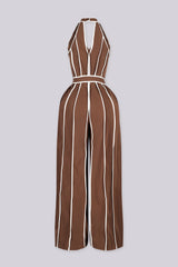 Wide leg halter jumpsuit with a plunging V neckline featuring waist tie