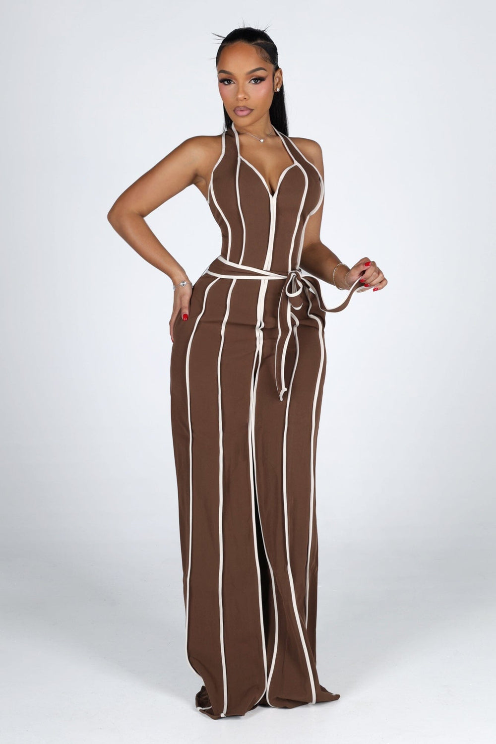 Wide leg halter jumpsuit with a plunging V neckline featuring waist tie