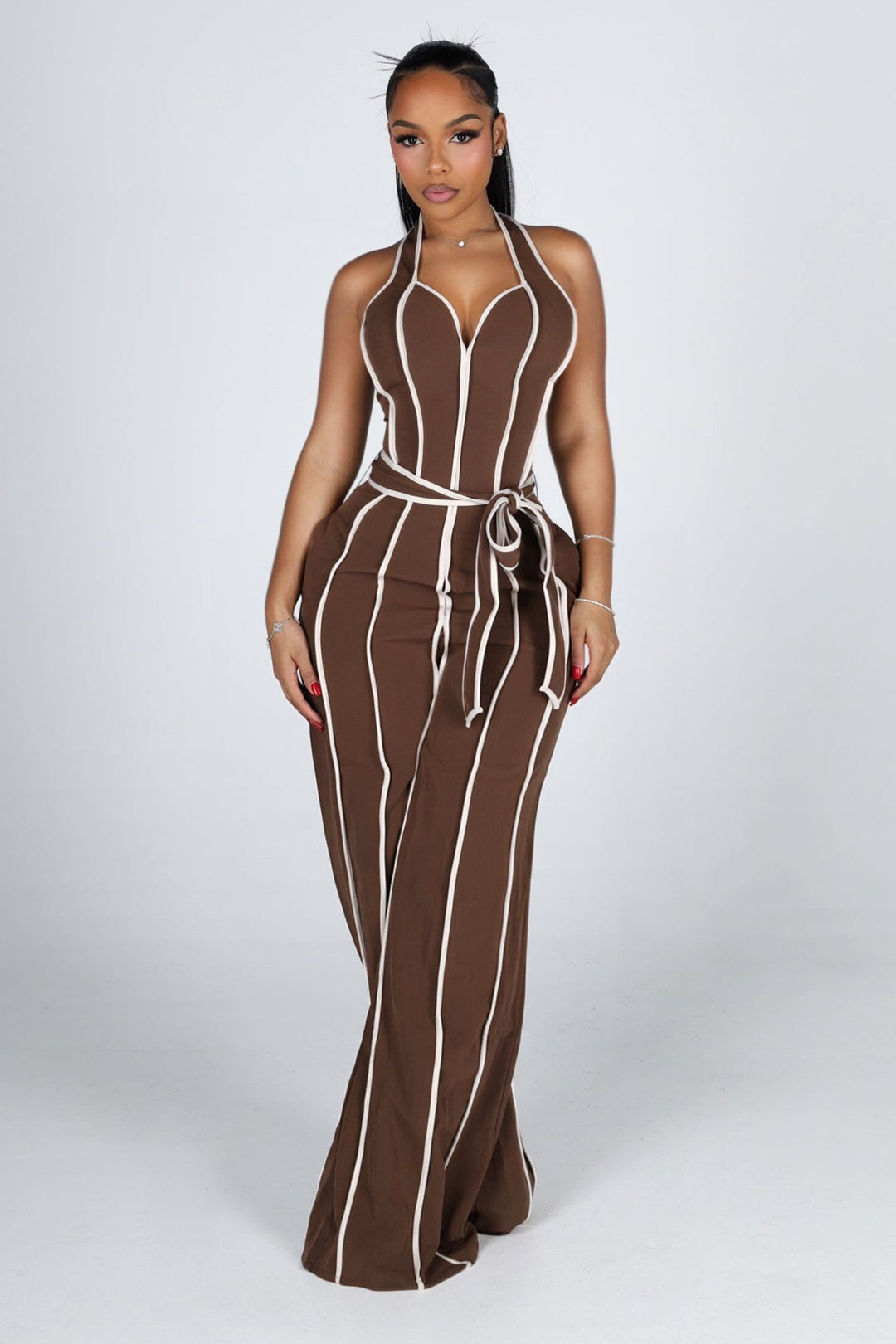 Wide leg halter jumpsuit with a plunging V neckline featuring waist tie