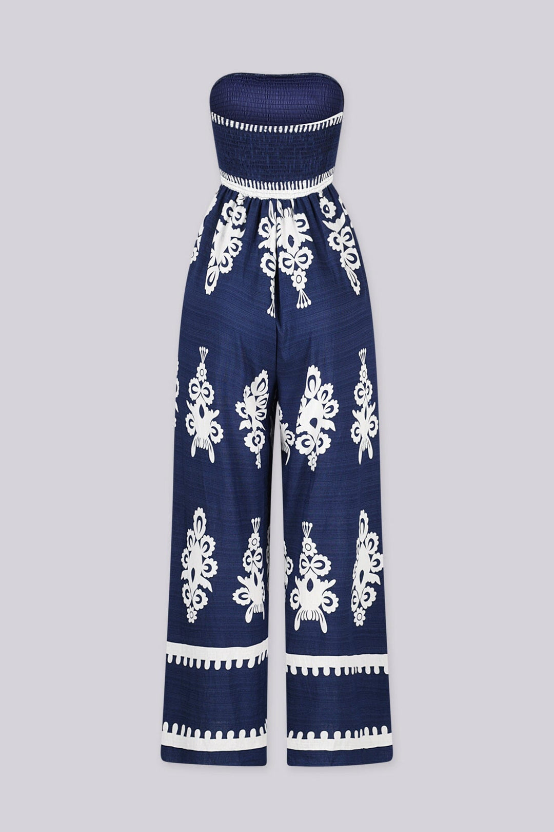 Wide leg strapless jumpsuit featuring high contrast retro print
Elasticized smocked tube top with pull on styling