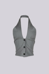 Adjustable halter neck vest top featuring open back with buckle strap detailing