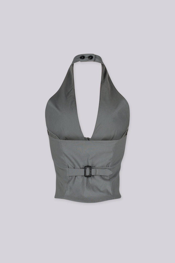 Adjustable halter neck vest top featuring open back with buckle strap detailing