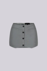 Tailored mini skirt with decorative welt pocket and button up details at front