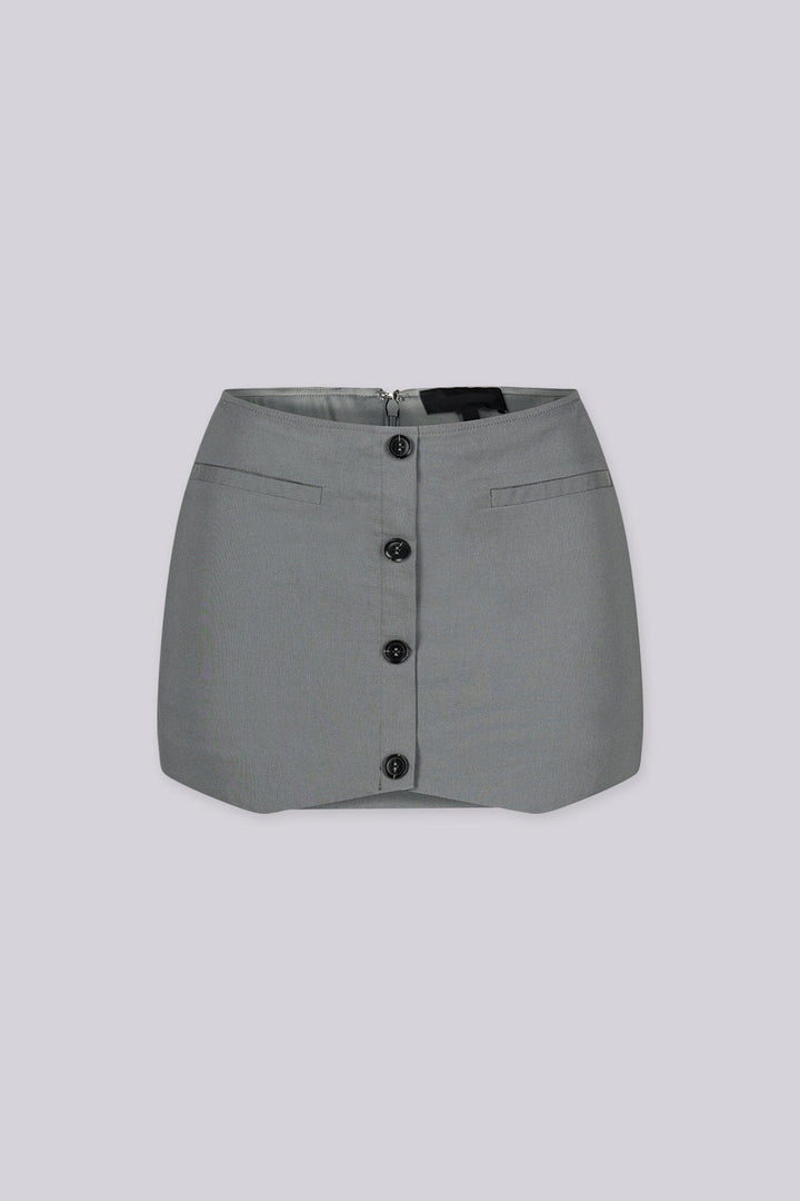 Tailored mini skirt with decorative welt pocket and button up details at front