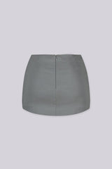 Tailored mini skirt with decorative welt pocket and button up details at front