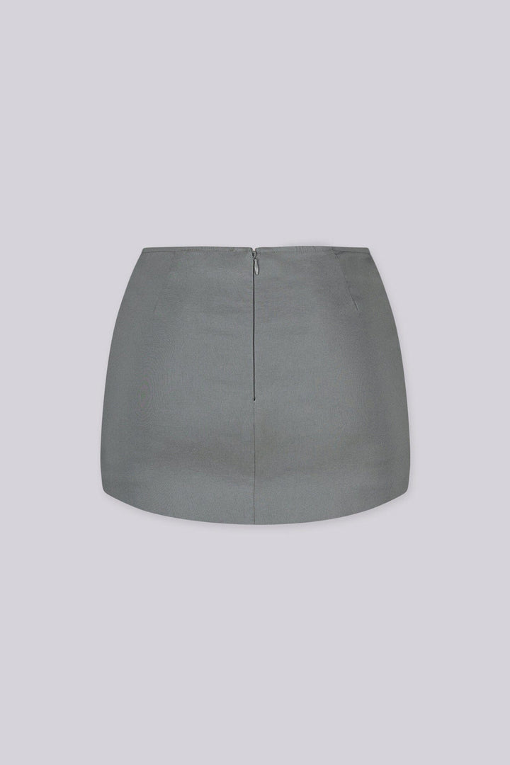 Tailored mini skirt with decorative welt pocket and button up details at front