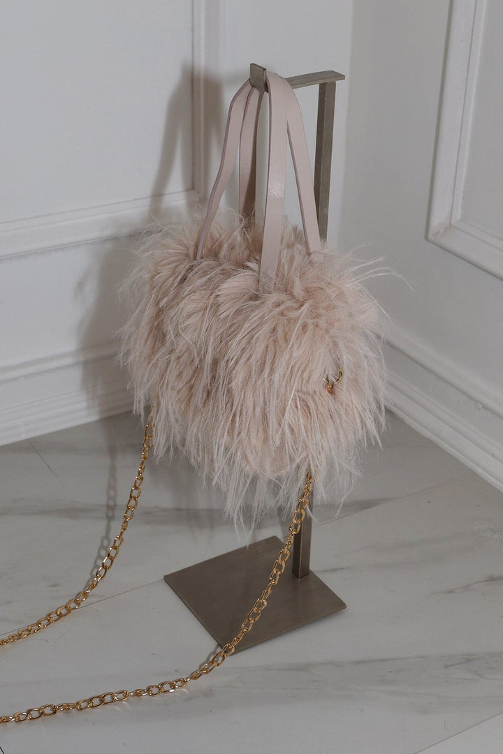 EDGE — natural faux fur mini bag displayed on a stand, side view flat lay