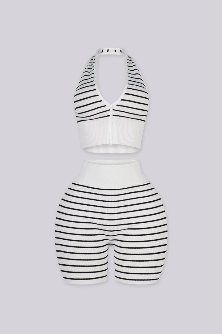 Plunging halter neckline with a half zip closure down the center front, Matching mid length biker shorts designed with a white fold over waistband