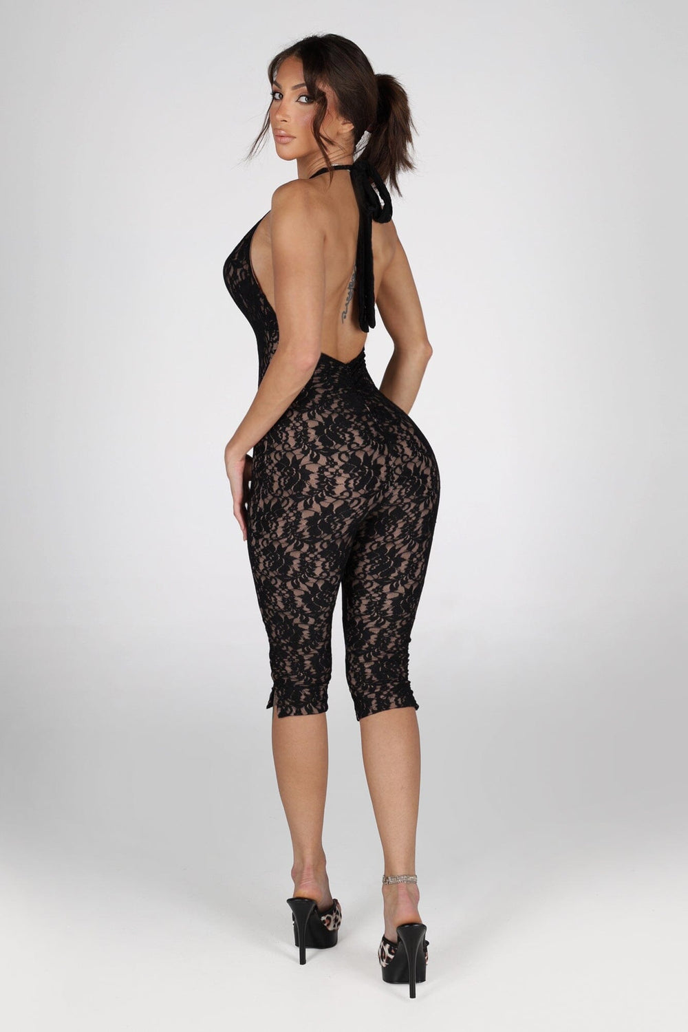 Sheer floral lace capri jumpsuit with deep V plunging halter neckline