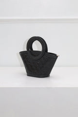 EDGE — black rhinestone-embellished top-handle bag, angled view flat lay