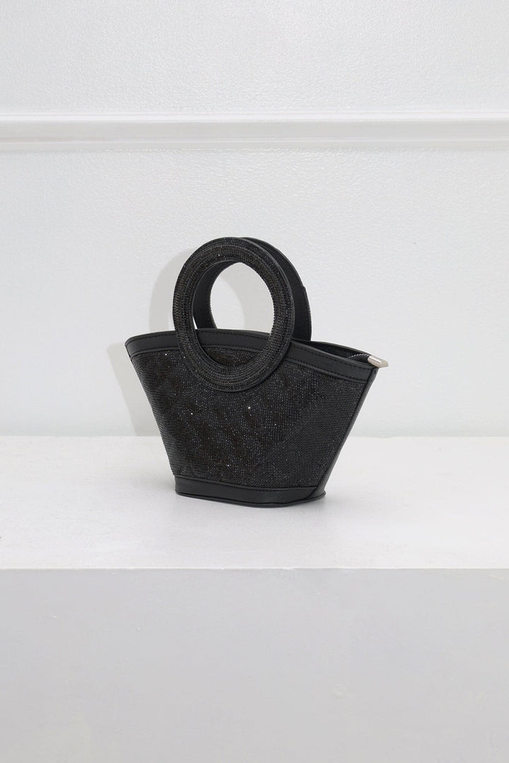 EDGE — black rhinestone-embellished top-handle bag, angled view flat lay