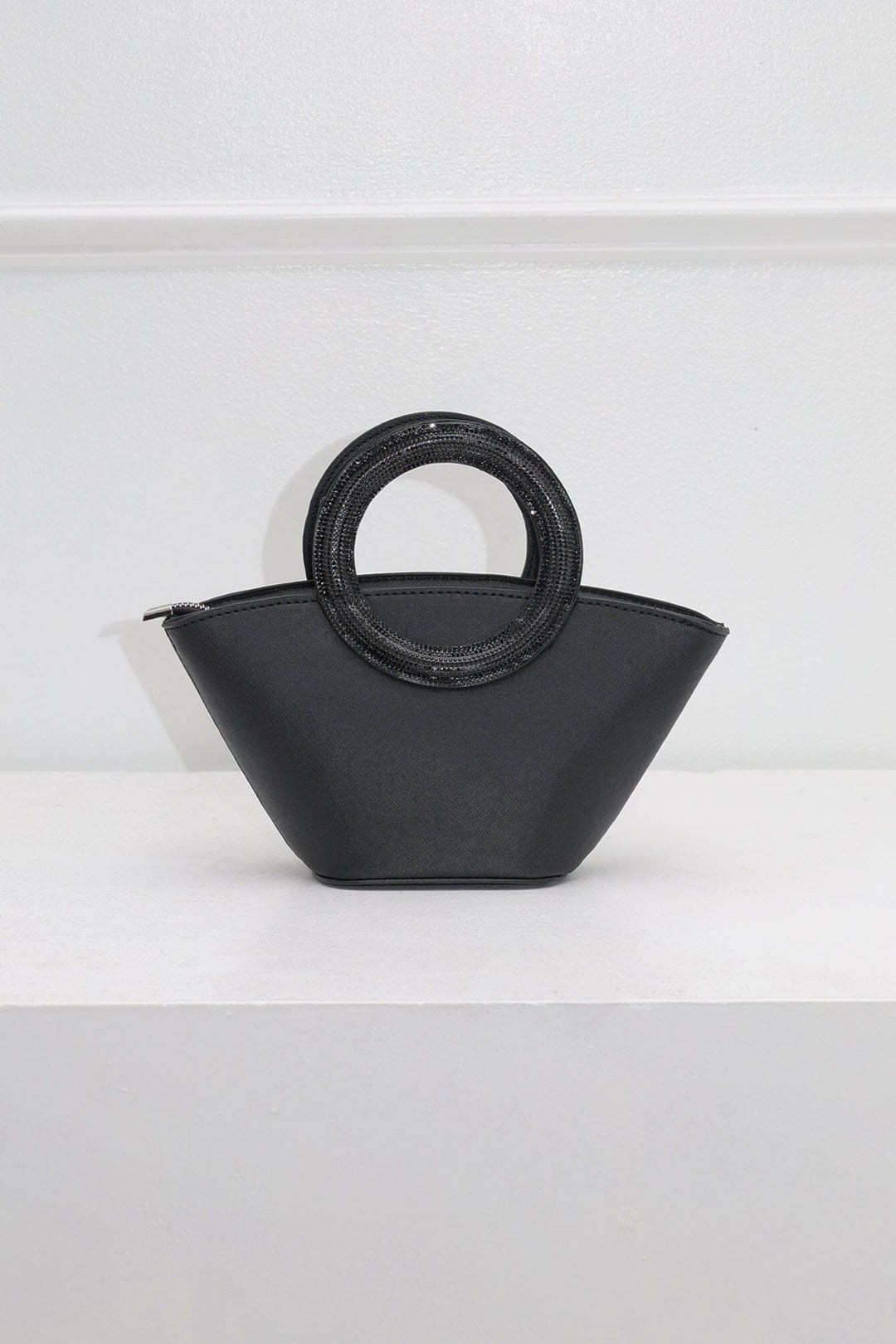 EDGE — black rhinestone-embellished top-handle bag, close front view flat lay