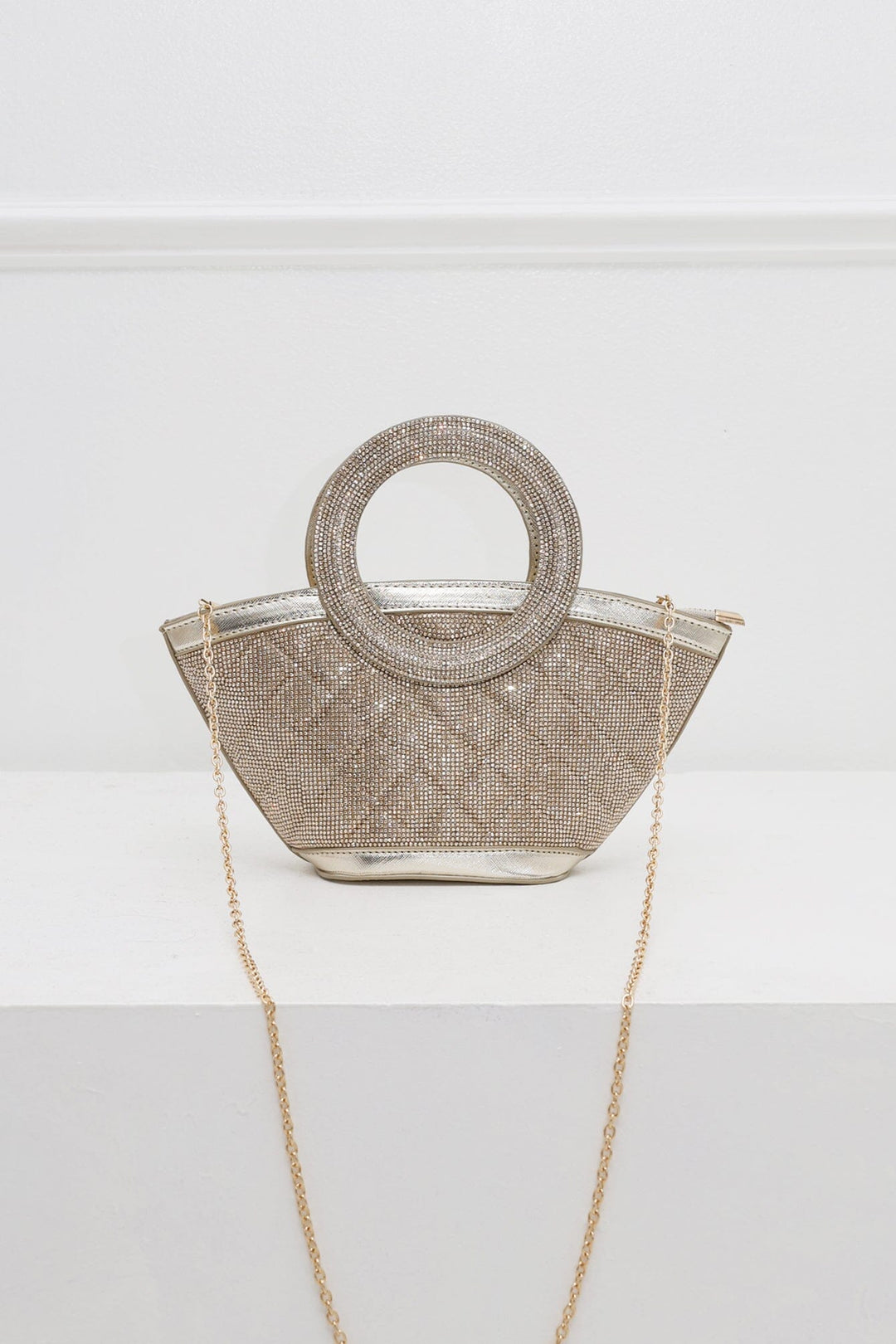 EDGE — gold rhinestone-embellished top-handle bag with detachable chain strap, flat lay