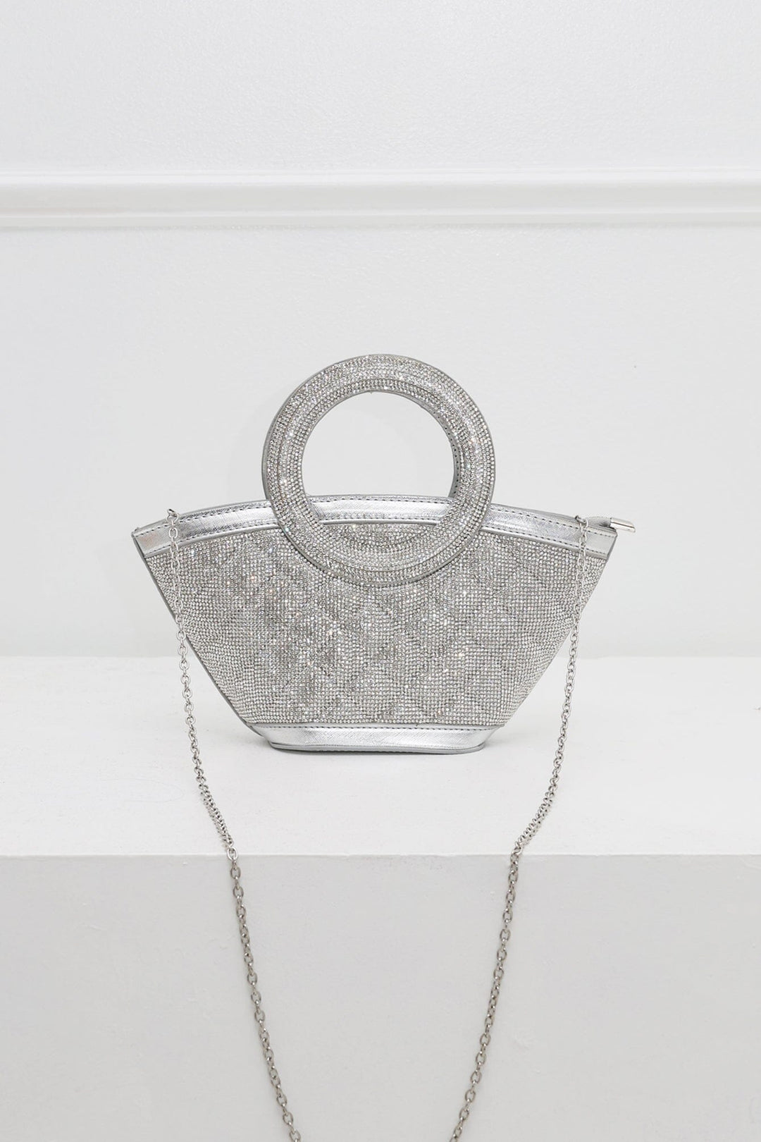 EDGE — silver rhinestone-embellished top-handle bag with detachable chain strap, flat lay