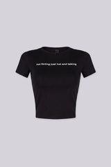 Cropped crew neckline graphic tee with "not flirting just hot and talking"