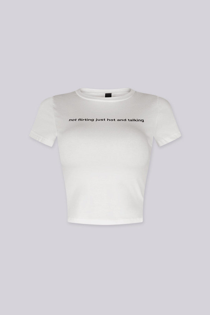 Cropped crew neckline graphic tee with "not flirting just hot and talking"