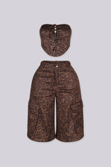 Leopard print tube top with rhinestone embellishments throughout featuring lace up front detailing