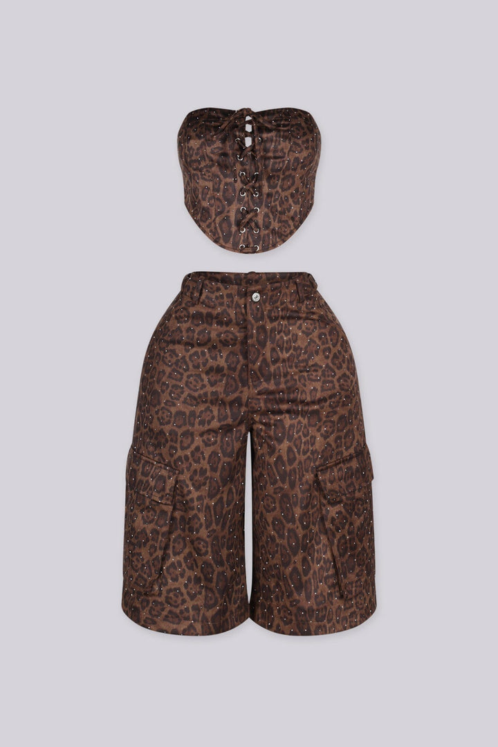 Leopard print tube top with rhinestone embellishments throughout featuring lace up front detailing