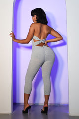 Halter neck capri jumpsuit with plunging deep V neckline
Open back with a crisscross twist detail and flattering ruching waist seam