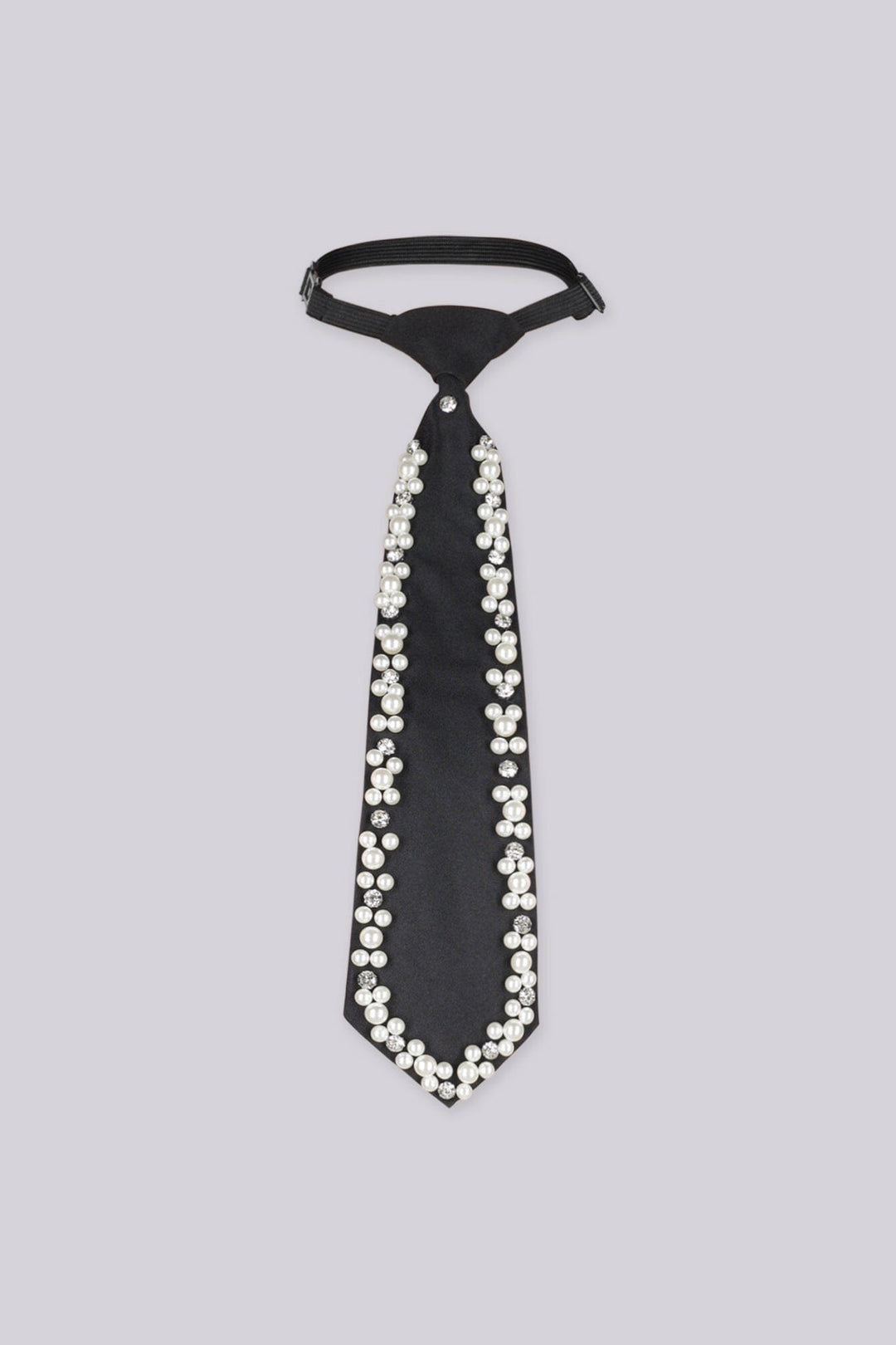 Black necktie embellished with pearls and rhinestones along the edges, flat lay