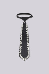 Black necktie embellished with pearls and rhinestones along the edges, flat lay