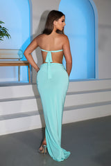 Strapless maxi dress featuring deep plunging slit keyhole down the center bust and high front thigh slit
Oval cutout detail with silver hardware at the center front